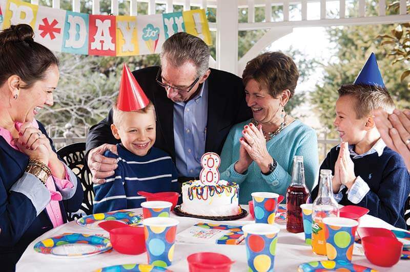 family celebrating in white gazebo
