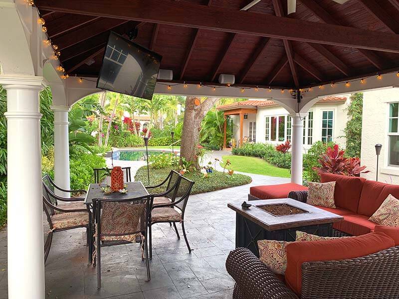 vinyl pavilion with tv, outdoor furniture, and lighting