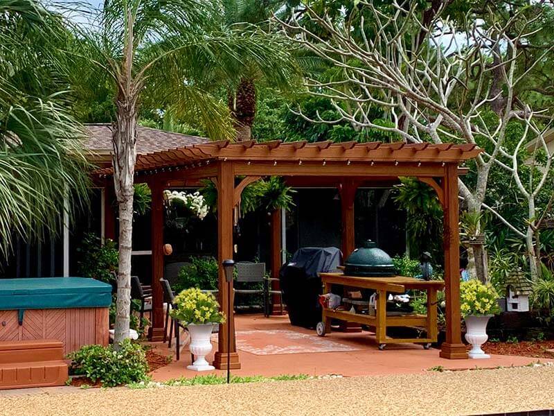 classic wood pergola with canyon brown stain and hot tub
