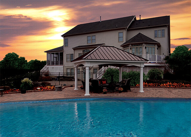 pavilion on a patio next to a swimming pool