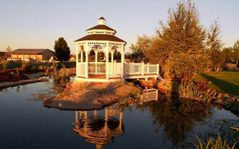 gazebo next to a pond