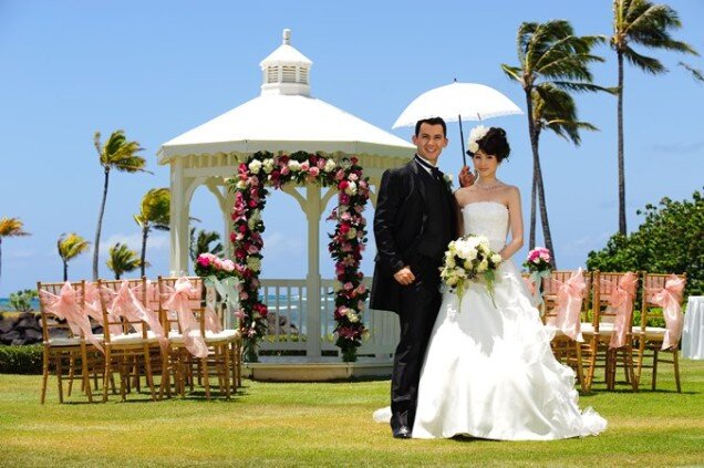 married couple by a wedding gazebo