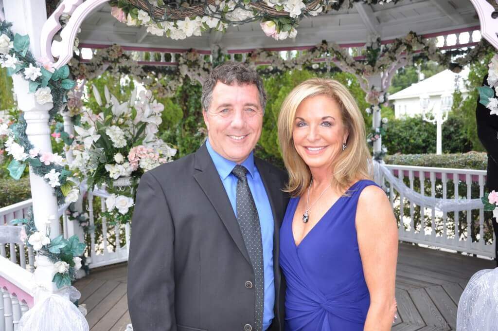 Couple standing inside gazebo