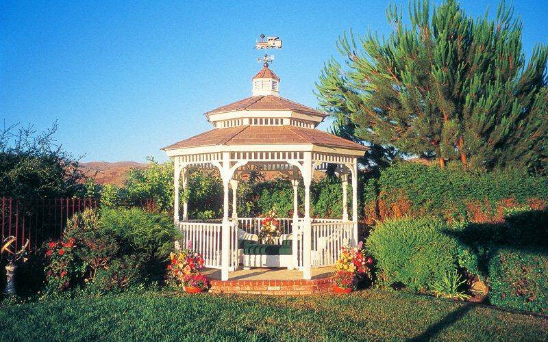 white gazebo with train weathervane