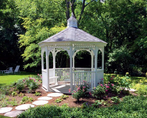 white gazebo with small table and chairs
