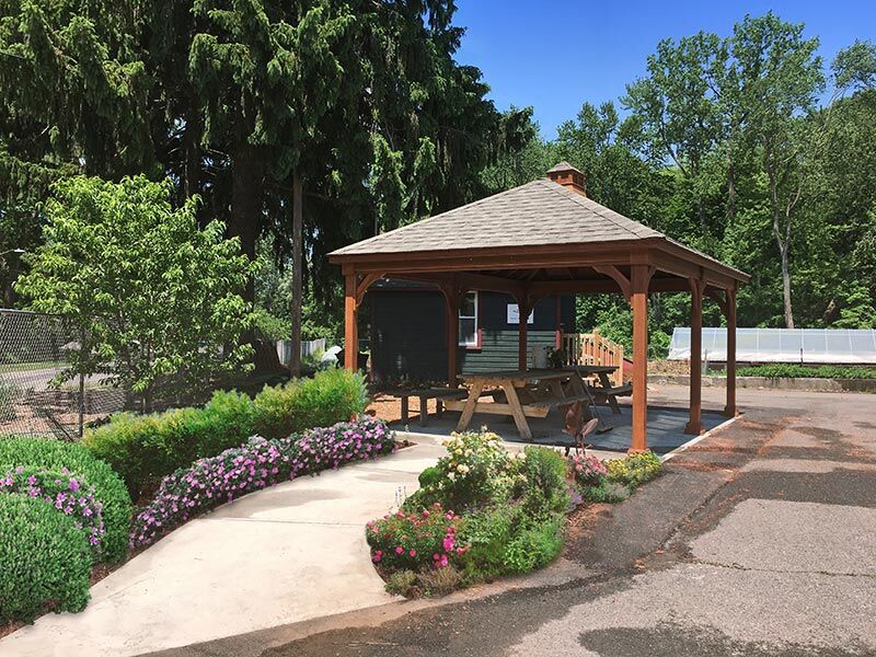 wood pavilion with picnic bench