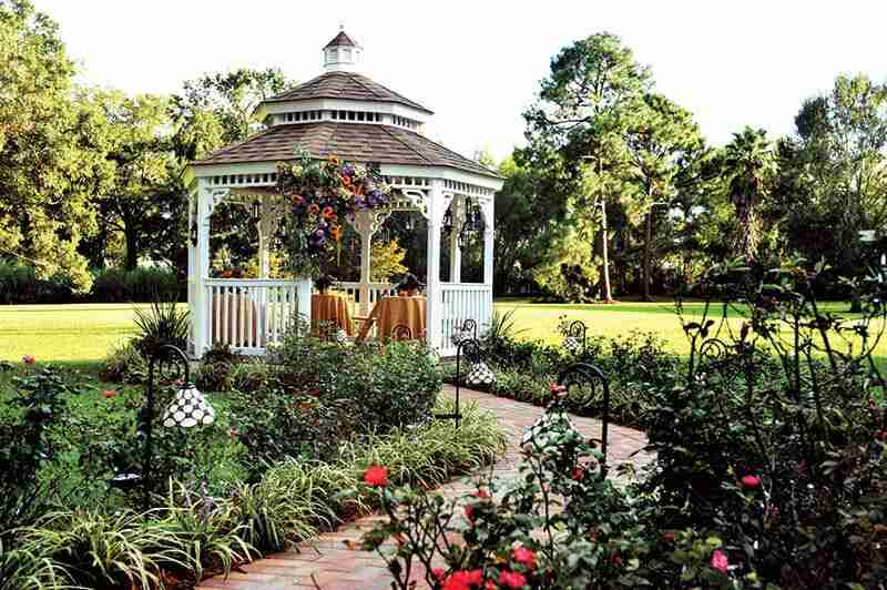 white gazebo in a garden