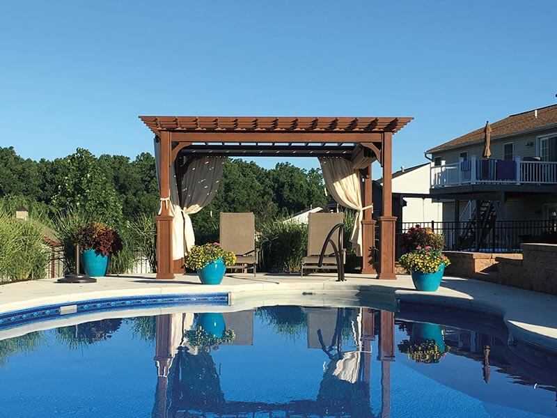 pergola next to a swimming pool