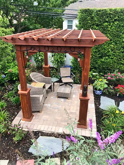 Wooden Pergola on a patio in a garden