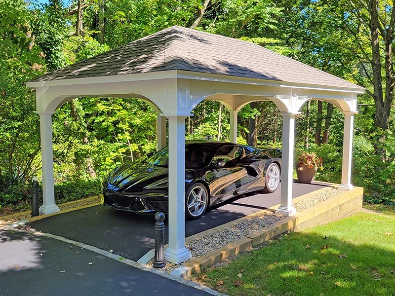 Car underneath a carport pavilion