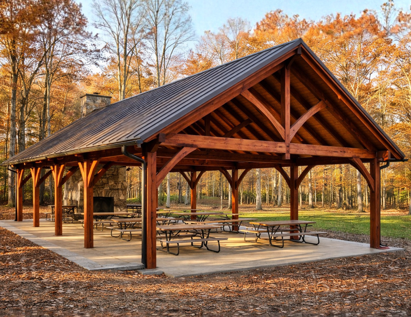 Wood A-frame pavilion with exposed timber beams in outdoor landscape